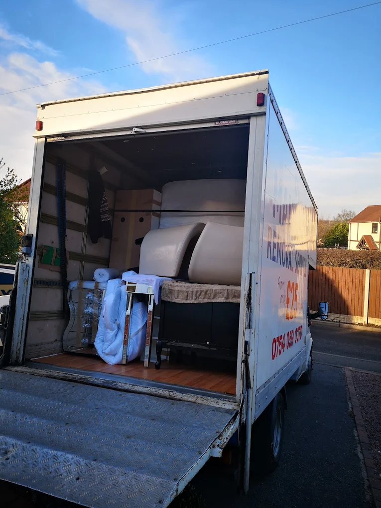 Inside the D's Man & Van removal van — furniture safely loaded and secured